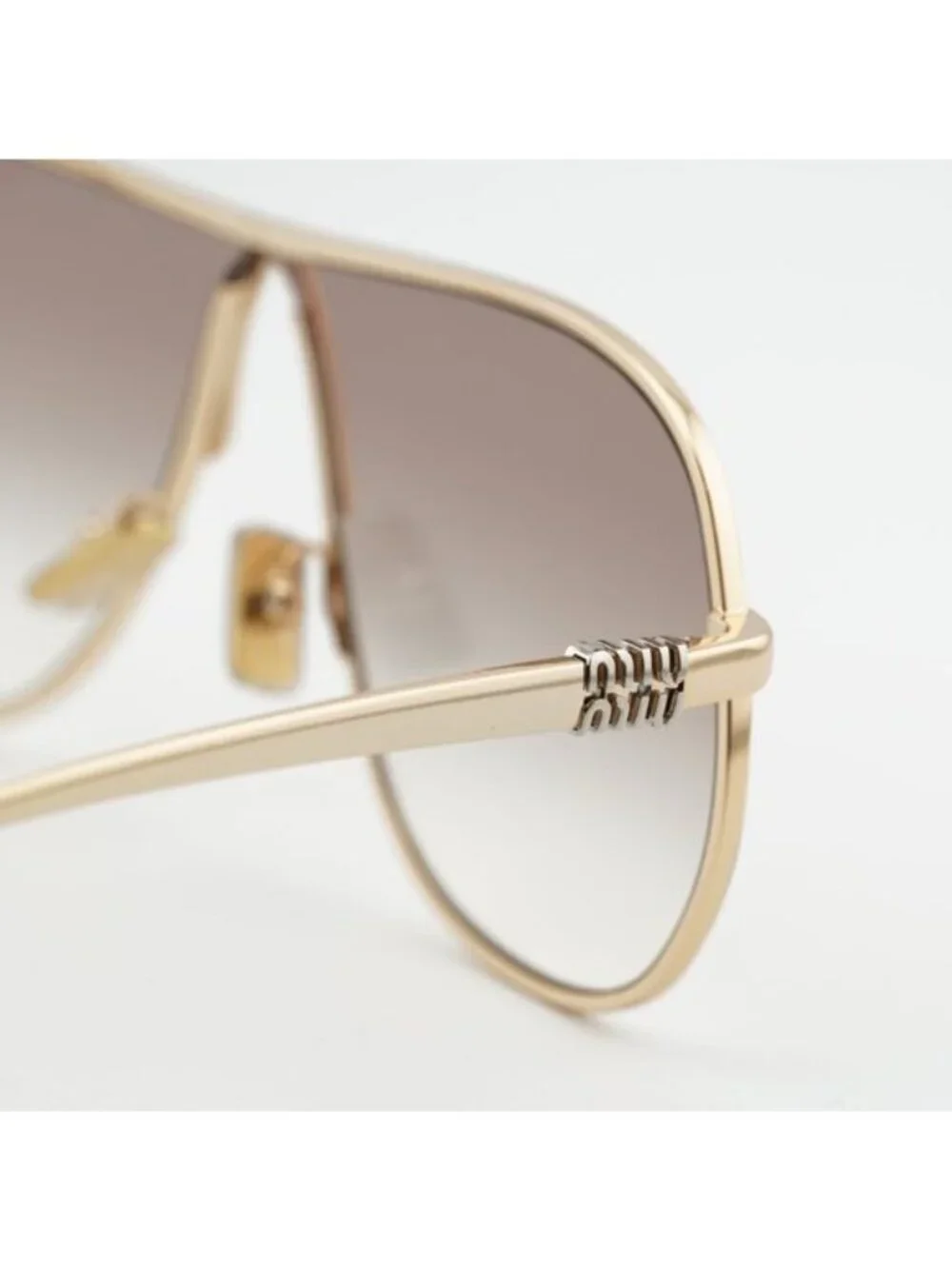 Miu Miu MUA56S 5AK90L Sunglasses Gold Geometric Frame, Brown Lenses